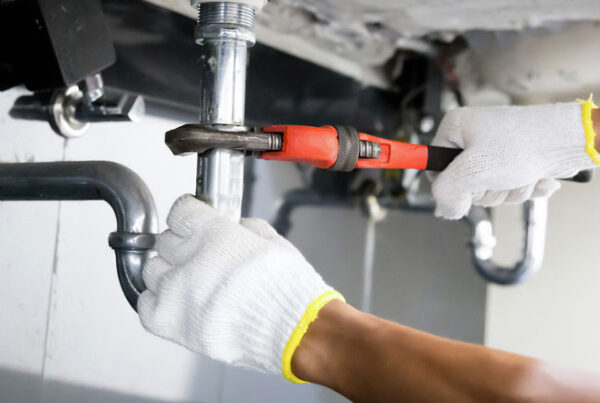 close up on a sink pipe being worked on